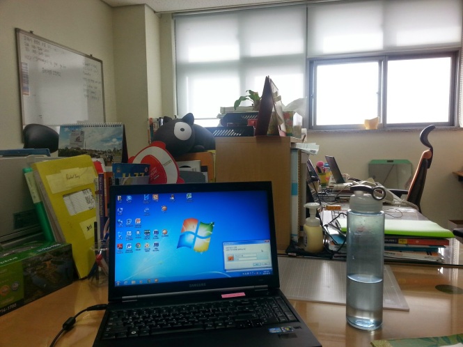 Here is the office. There are five desks including mine.